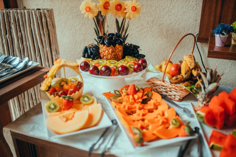 Catering platters of fresh sliced fruit at an event