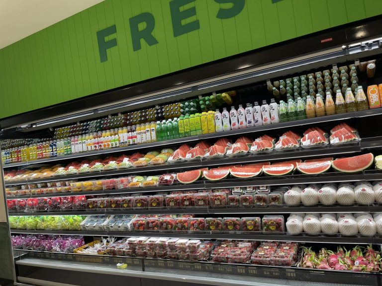 Fresh fruit and vegetable wall under the FRESH sign at WA Growers Fresh