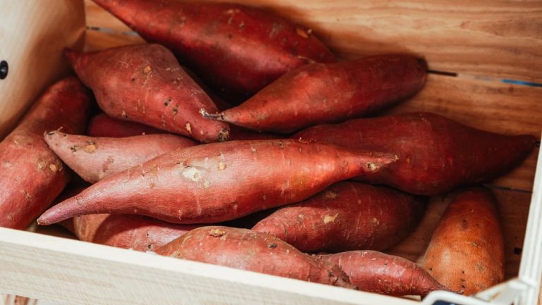 Sweet potatoes in a wooden crate